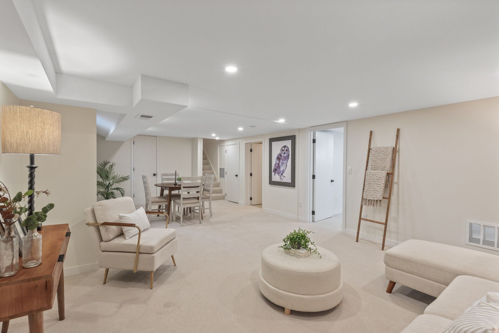 Finished lower level family room with new carpet and recessed lights