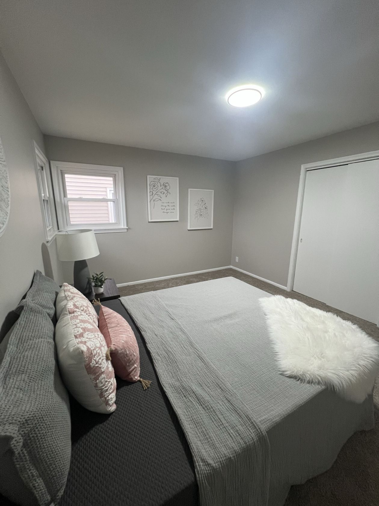 Bedroom with new paint, carpet, and trim