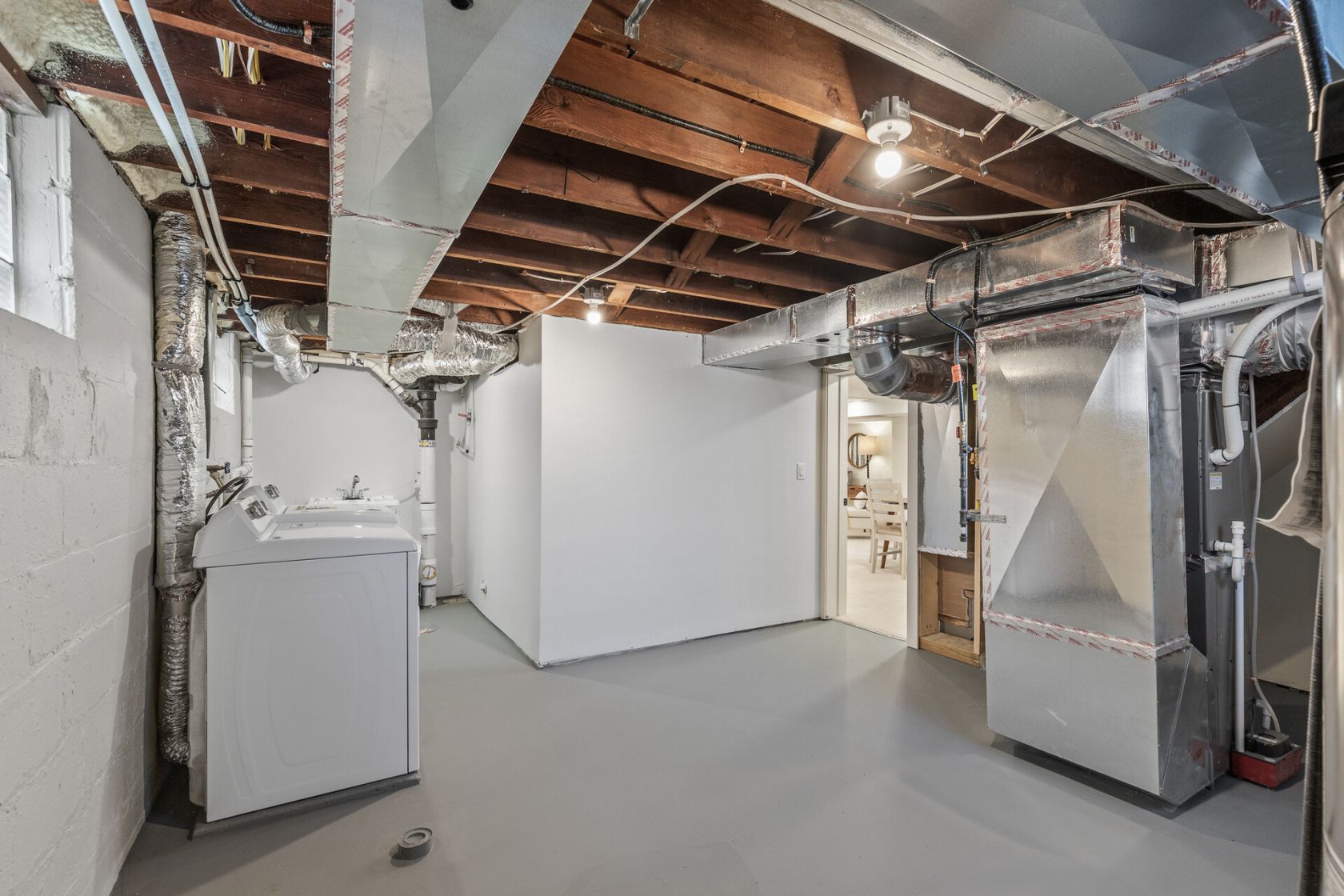 Mechanical and laundry room with new ductwork and sealed floor