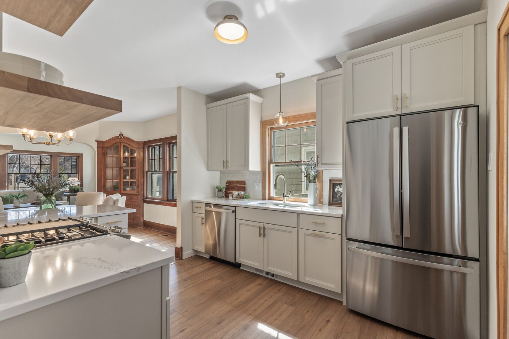 Kitchen island and prep sink with views into dining room