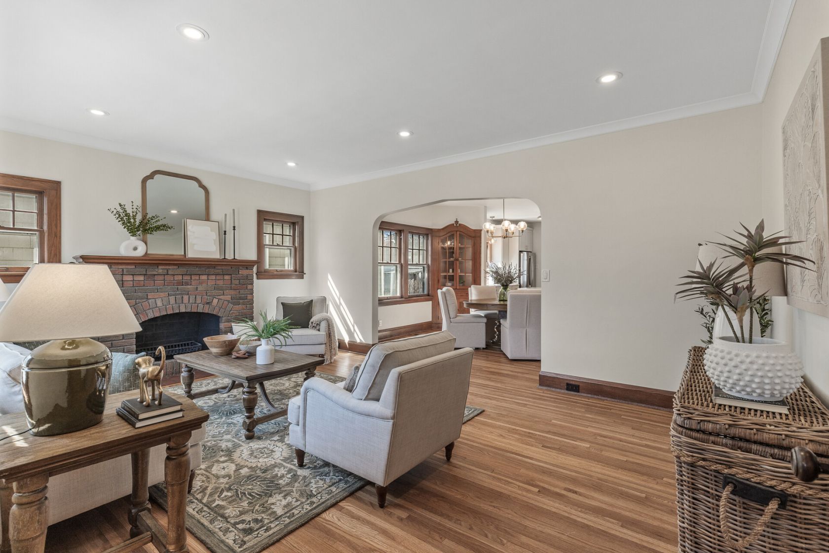 Open sightline from living room through arched opening to dining