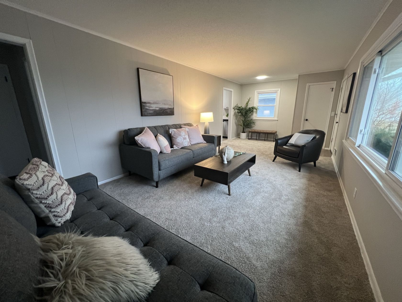 Open living room with new carpet and trim